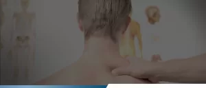 male experiencing neck pain and treatment